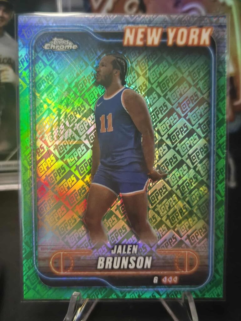 Card Details
Player: Jalen Brunson, New York Knicks
Set: 2024-25 Topps Chrome Basketball
Card Number: 47
Parallel/Variety: Green Refractor (an unnumbered parallel, distinct from other numbered variations like the Pink Basketball Refractor or Prism Refractor)
Manufacturer: Topps
Estimated Value
The value of this particular card is generally low, similar to other non-numbered refractors.
Typical Price Range: Around \$1.50 to \$5.00 USD, depending on condition and seller.
Factors Affecting Value: The exact market price can fluctuate based on Jalen Brunson's performance, current market demand, and the card's physical condition (e.g., centering, corners, surface).